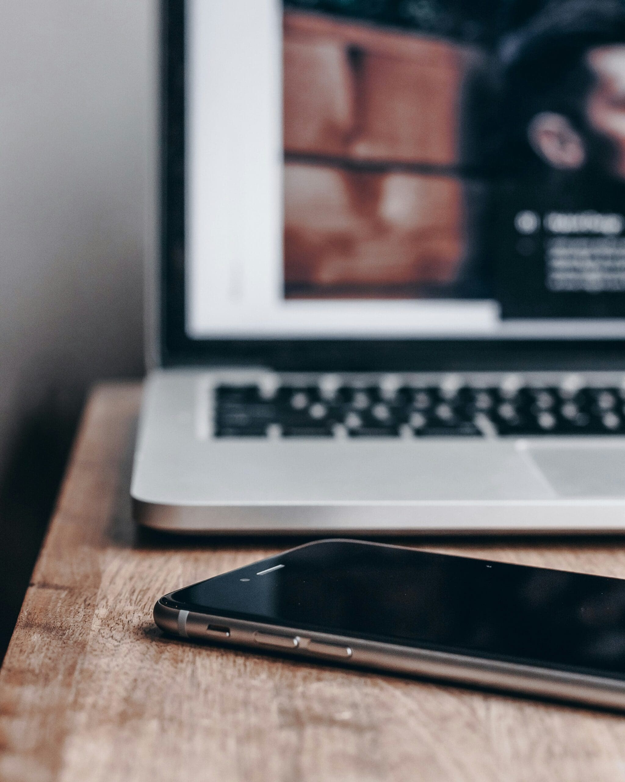 A laptop and smartphone side-by-side, symbolizing the importance of segmenting your audience across different devices and platforms for more effective marketing and better results. #audiencesegmentation #mobilemarketing #digitalmarketingplan