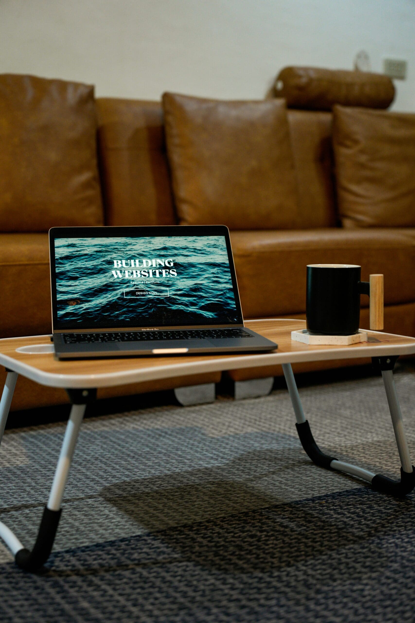 Someone working on a laptop with a website visible, representing the process of creating quality websites even with budget-friendly design options. #cheapwebsitedesign #budgetwebsitedesign #professionalwebsite