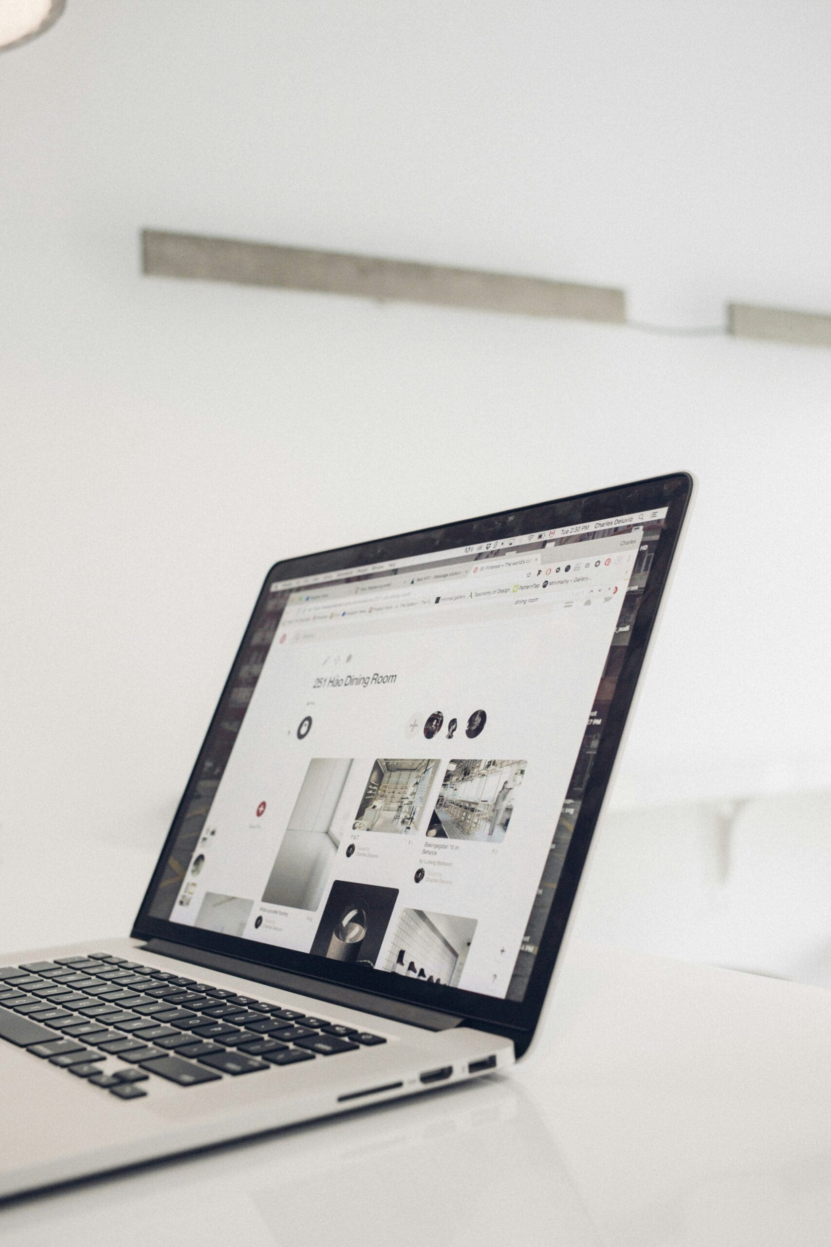 Someone working on a laptop showing a website, symbolizing the process of using digital tools to create aesthetically pleasing and visually impressive websites. #websitebuilder #designsoftware #digitaltools